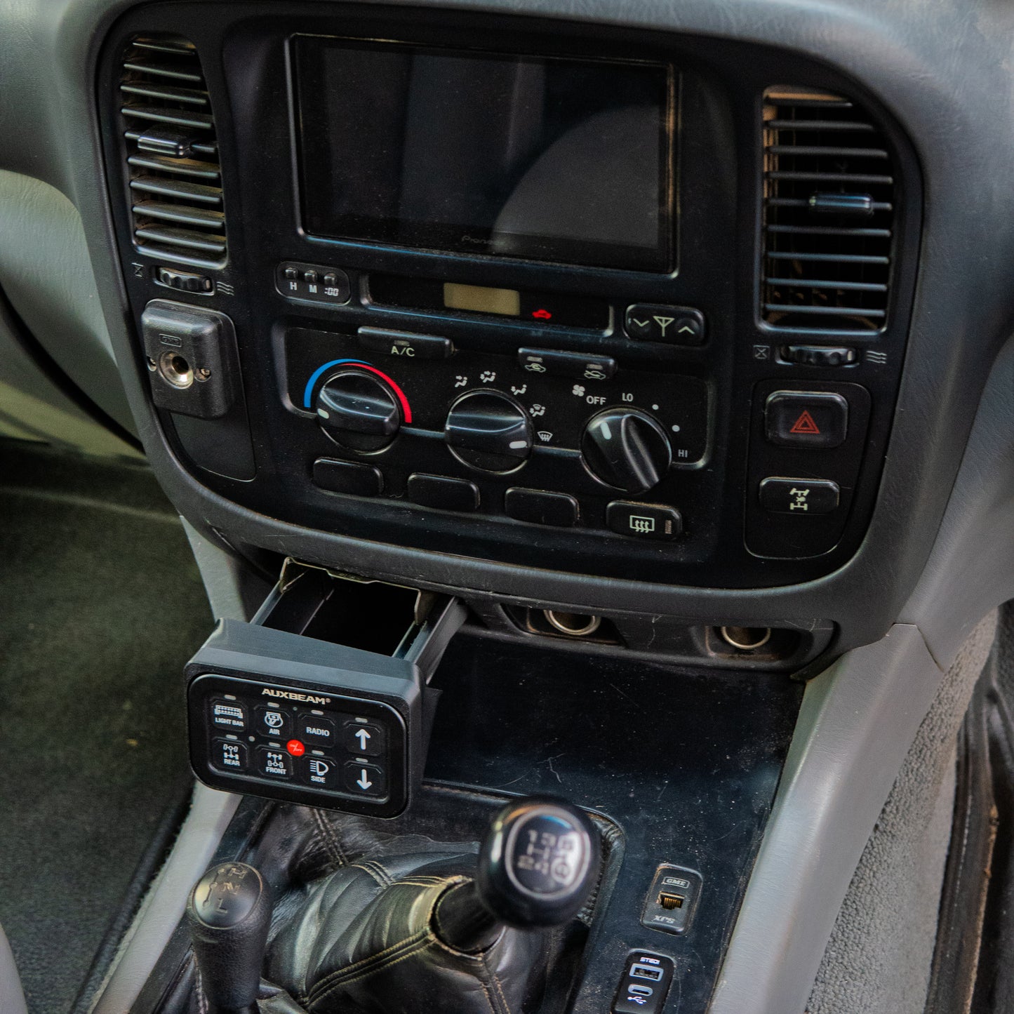 Toyota Landcruiser 100 105 series Auxbeam ashtray mount installed in car interior opened