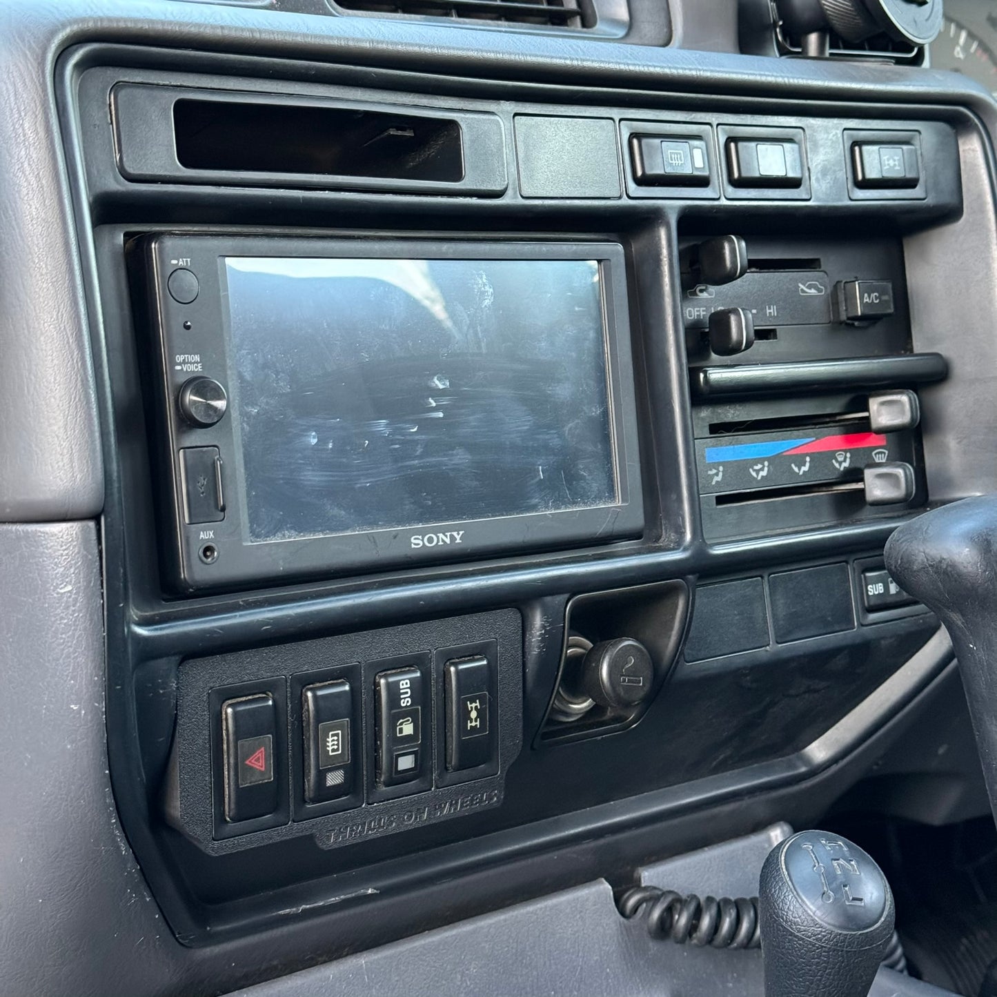 Toyota Landcruiser 80 Series late model ashtray switch plate with factory toyota style switches installed in car