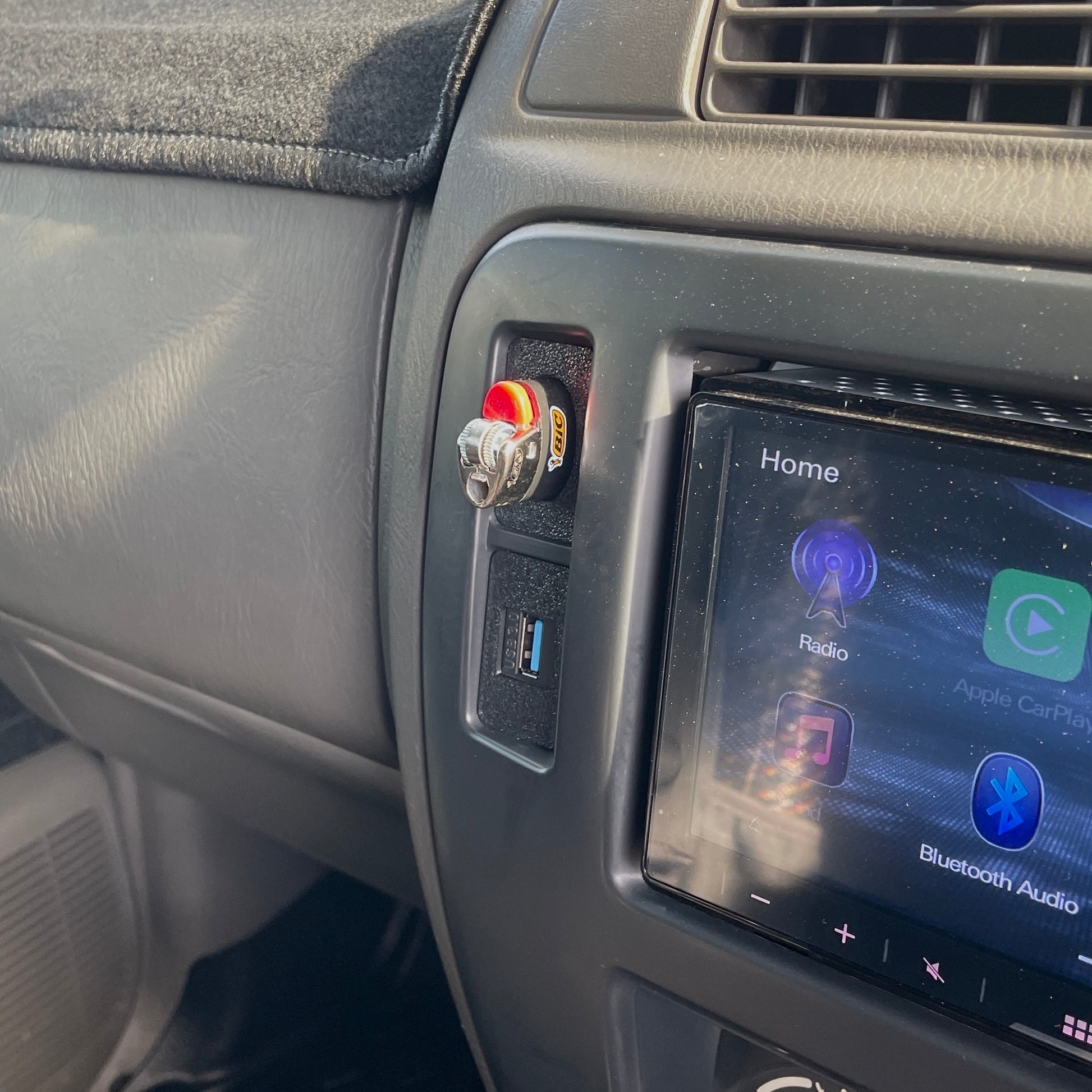 Nissan Patrol GU Series 3 USB pass through mount installed to radio surround