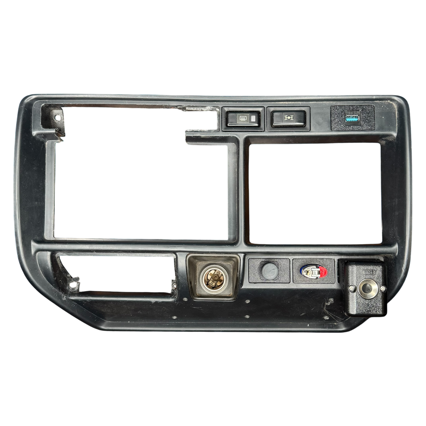 Car stereo dashboard panel showing a smoke holder and lighter holder