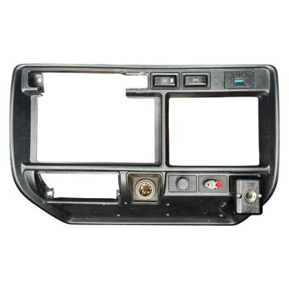 Car stereo dashboard panel showing a smoke holder and lighter holder