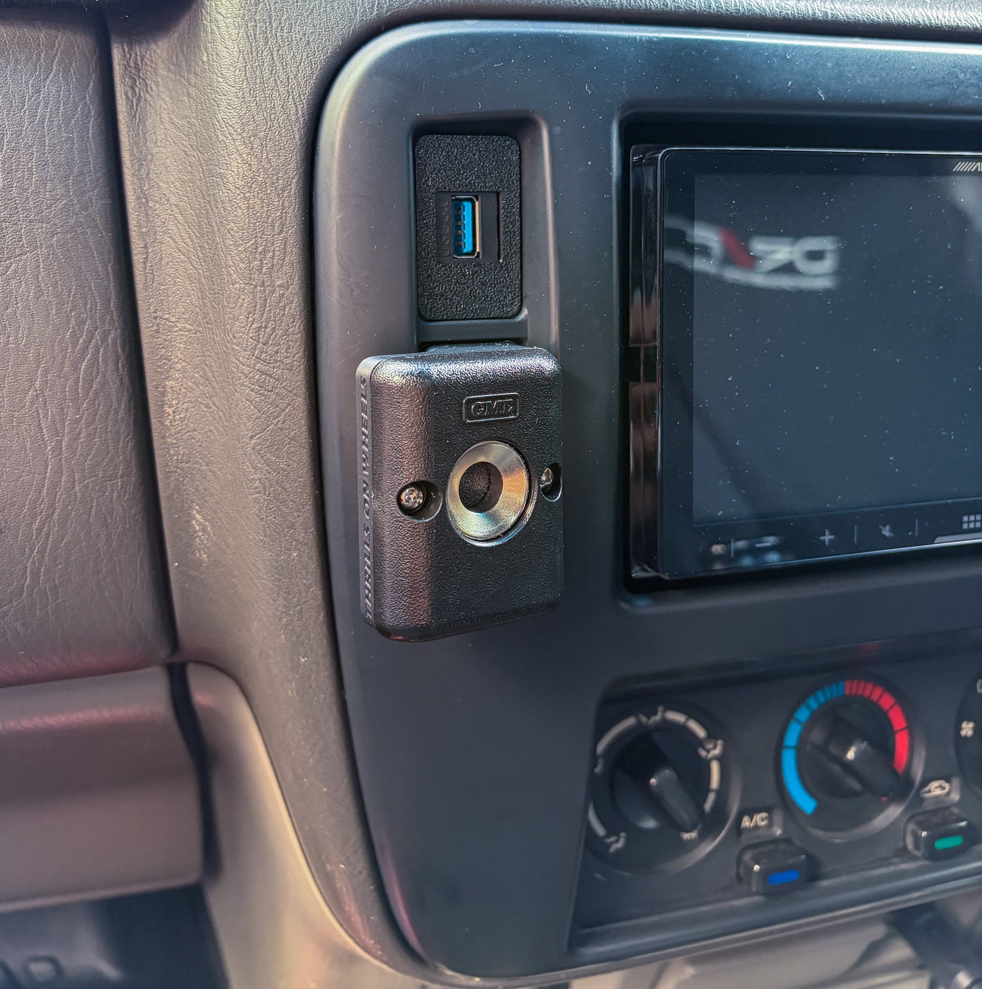 Nissan Patrol GU Series 1-3 UHF mount installed to GU Patrol radio trim in car close up