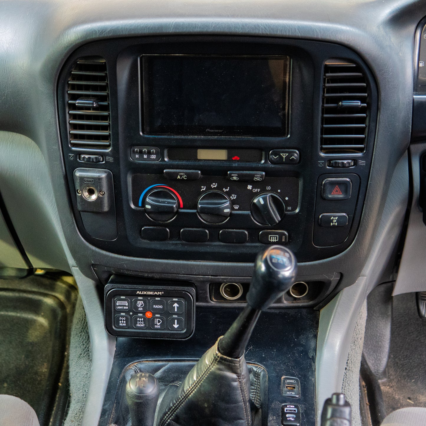 Toyota Landcruiser 100 105 series Auxbeam ashtray mount  installed in car interior
