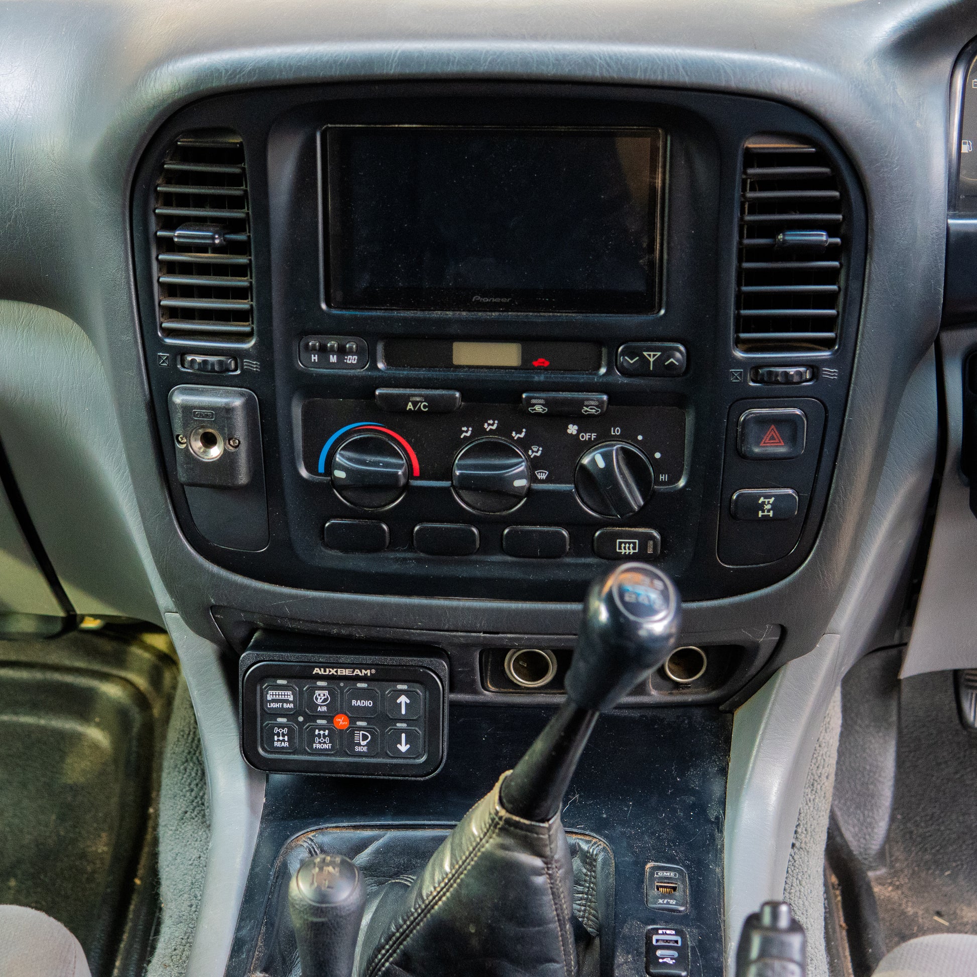 Toyota Landcruiser 100 105 series Auxbeam ashtray mount  installed in car interior