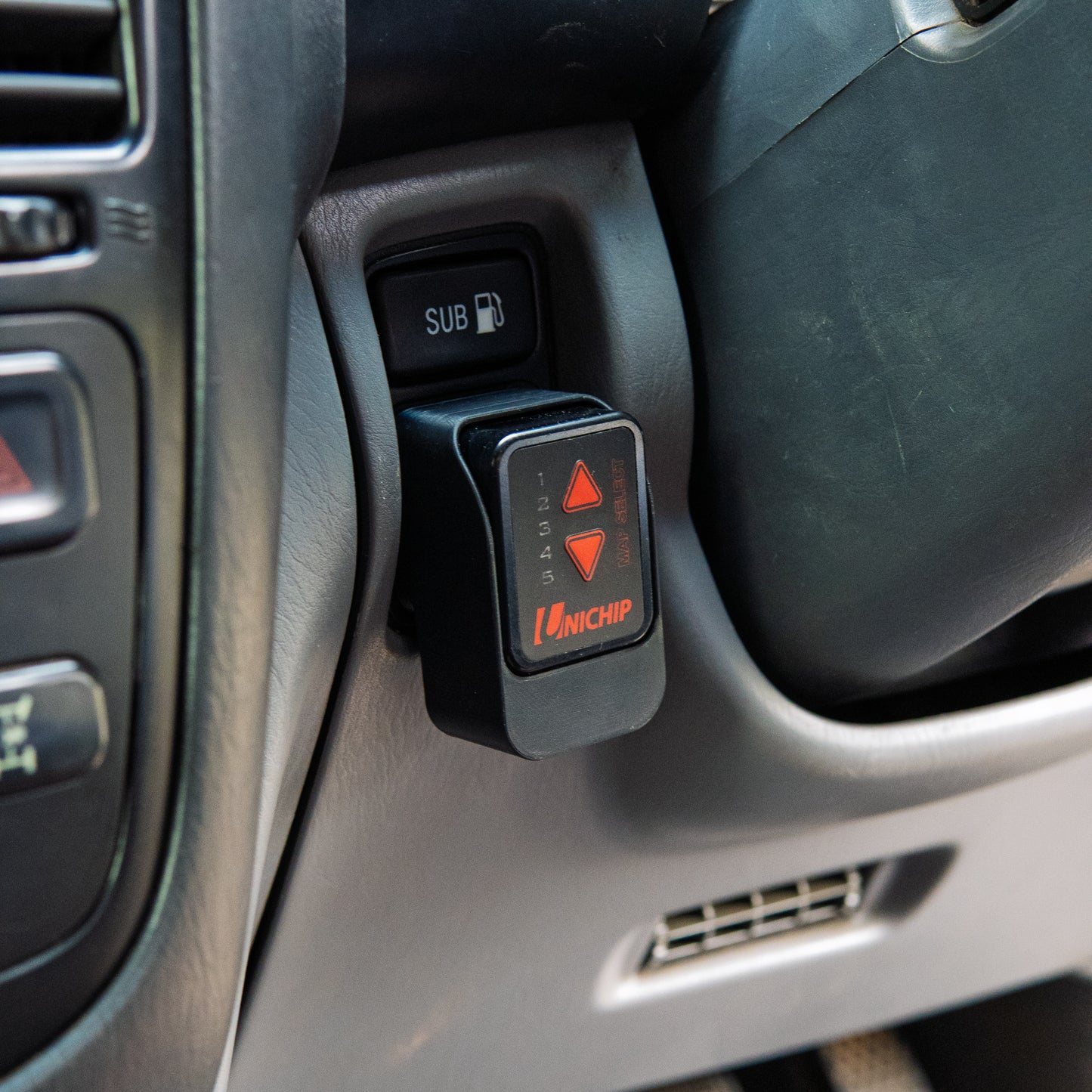 Landcruiser Unichip mount installed to 100 105 series Landcruiser in car close up
