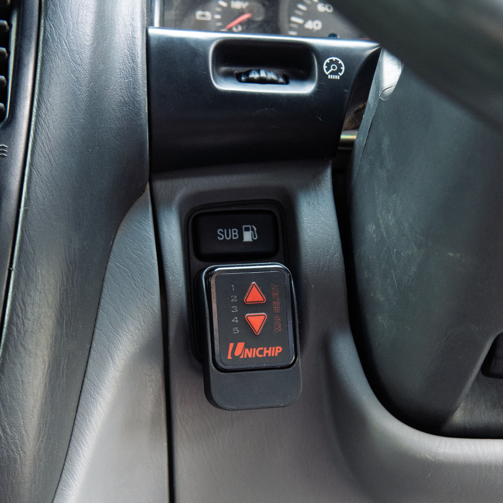 Landcruiser Unichip mount installed to 100 105 series Landcruiser in car close up