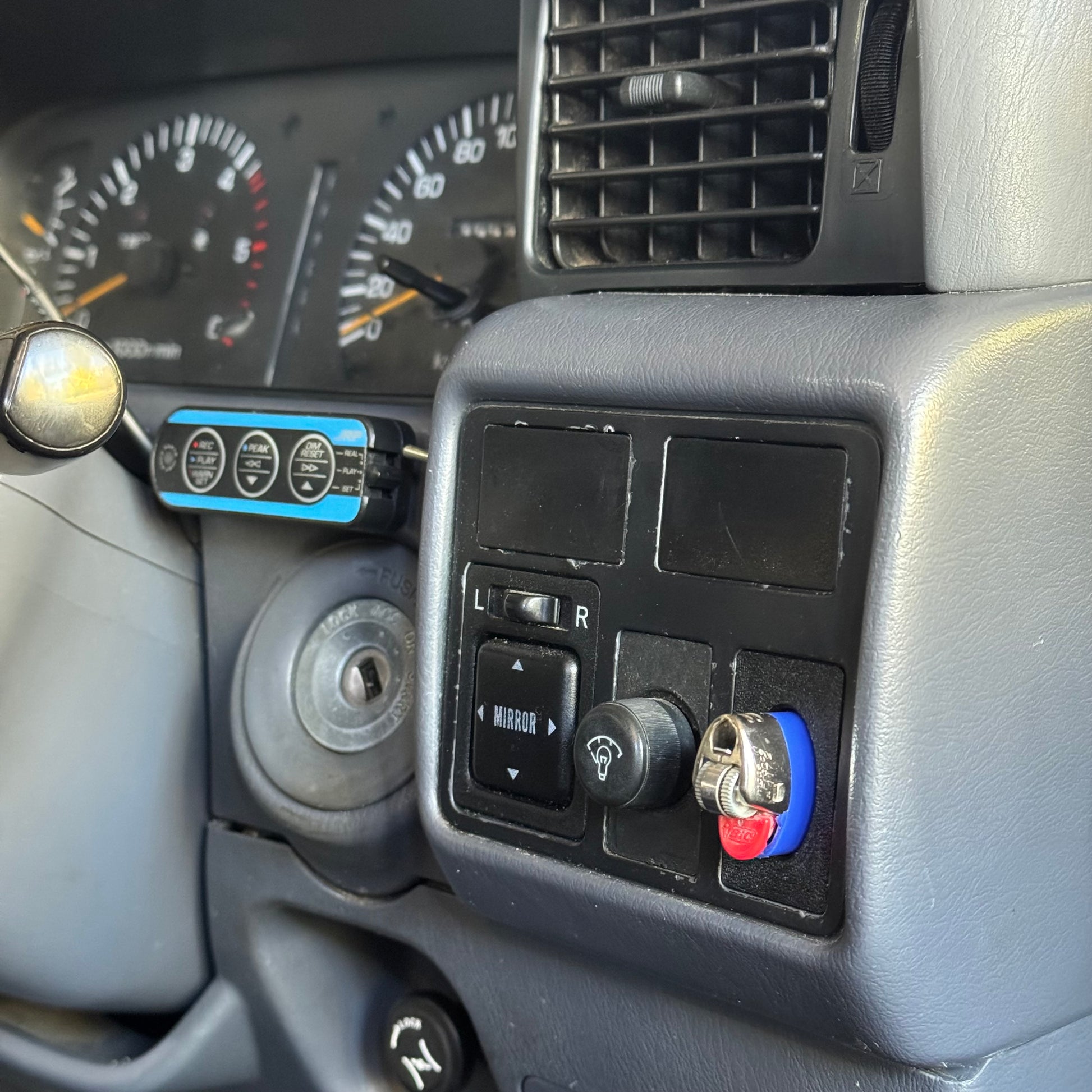 Toyota landcruiser 80 series bic lighter holder with lighter in it installed to car