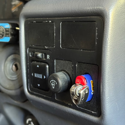 Toyota landcruiser 80 series bic lighter holder with lighter in it installed to car close up