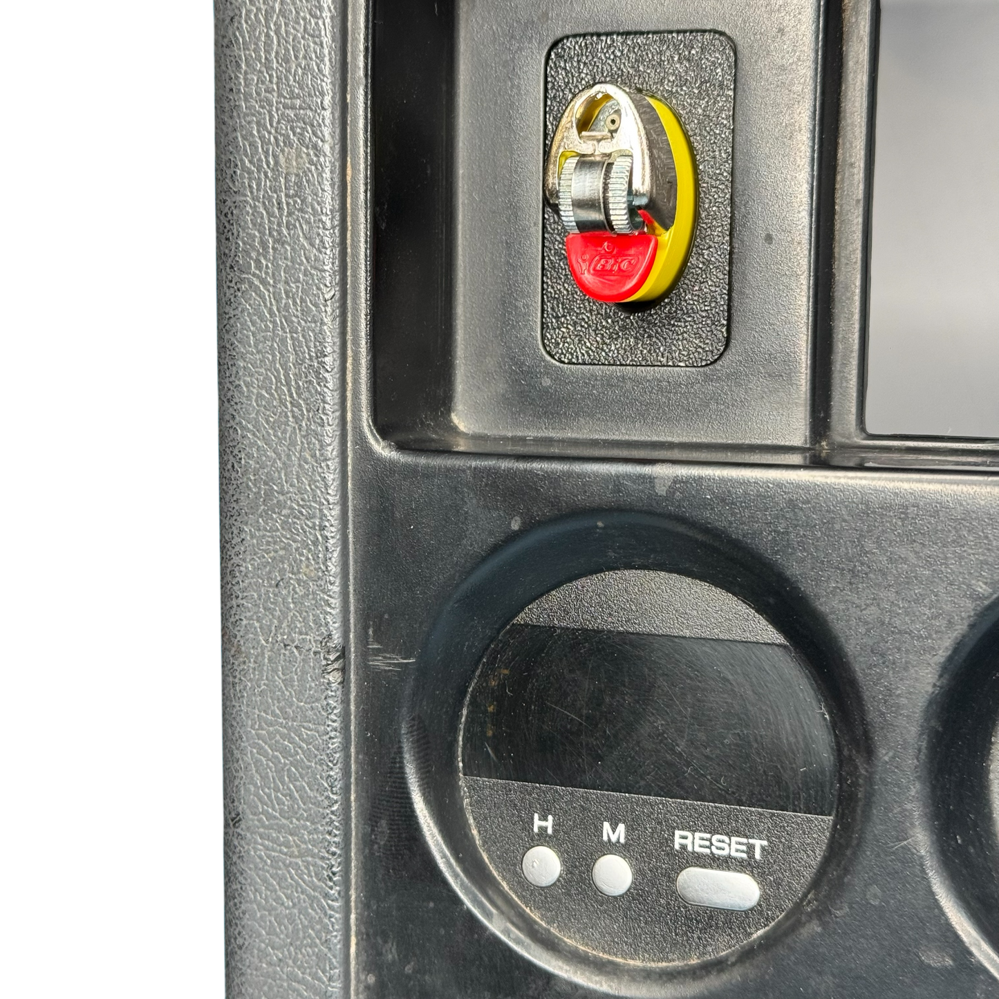 Nissan Patrol GQ Ford radio surround close up showing bic lighter holder installed