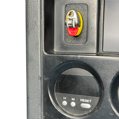 Nissan Patrol GQ Ford radio surround close up showing bic lighter holder installed